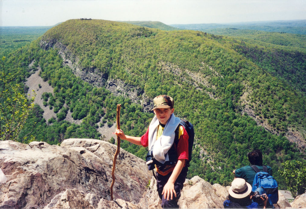 Hiker standing at the point of the water gap on Mt Tammany